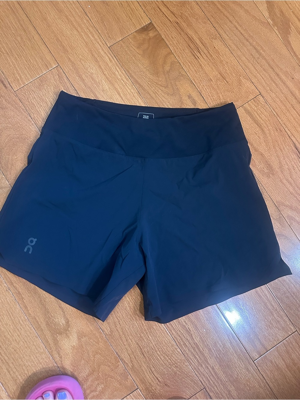 On Running Women's Black Athletic Shorts with Subtle Logo